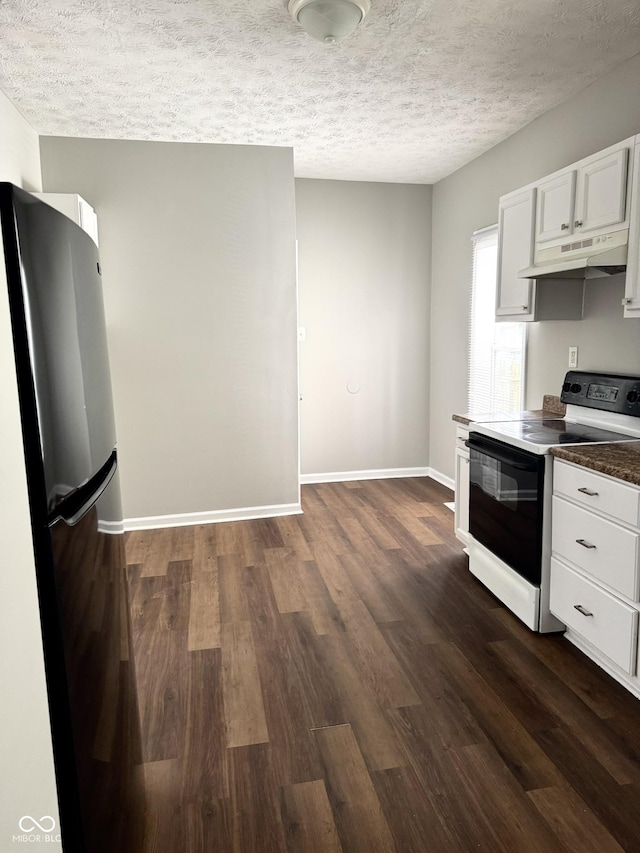 3502 N Illinois St, Indianapolis, IN 46208 - kitchen with dark wood finished floors, a textured ceiling, under cabinet range hood, range with electric stovetop, and baseboards