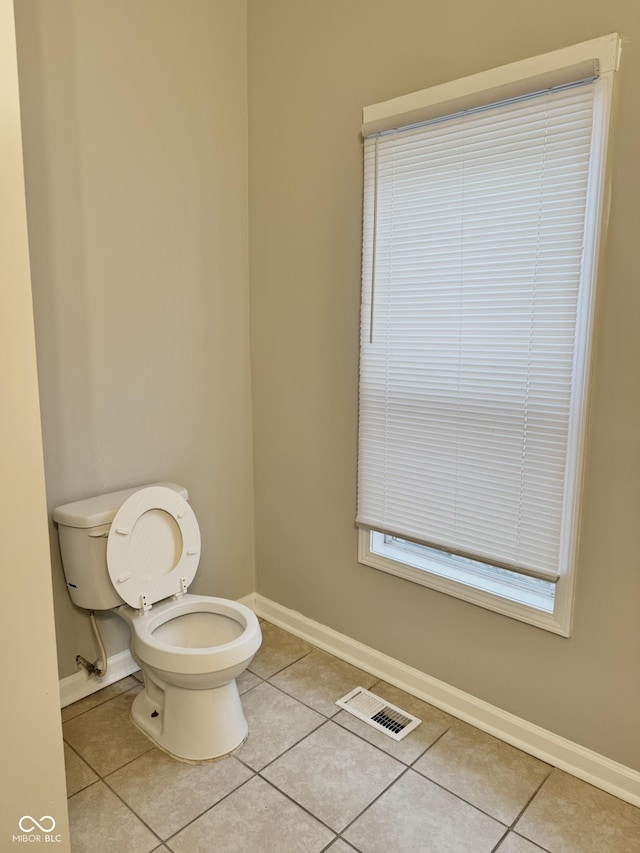3502 N Illinois St, Indianapolis, IN 46208 - bathroom with toilet, visible vents, tile patterned floors, and baseboards
