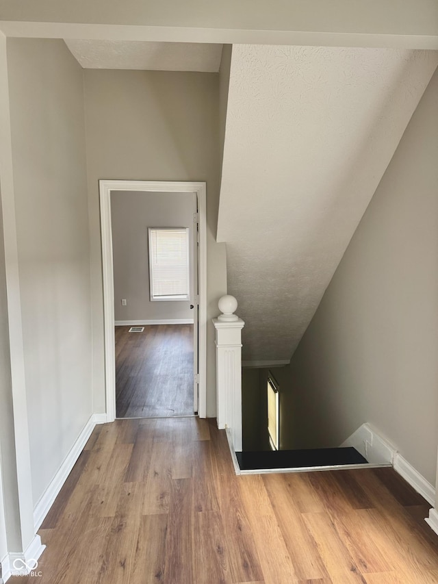 3502 N Illinois St, Indianapolis, IN 46208 - stairs featuring baseboards, wood finished floors, and lofted ceiling