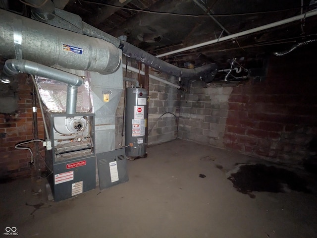 unfinished basement featuring water heater and concrete block wall