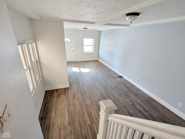 408 E Beecher St, Indianapolis, IN 46225 - unfurnished room featuring a textured ceiling, baseboards, and dark wood finished floors