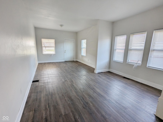 408 E Beecher St, Indianapolis, IN 46225 - unfurnished room with dark wood-type flooring and baseboards