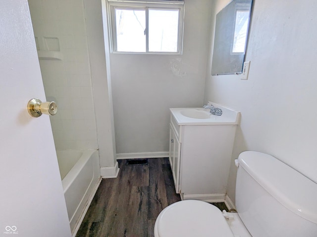 408 E Beecher St, Indianapolis, IN 46225 - full bath featuring toilet, vanity, wood finished floors, and plenty of natural light