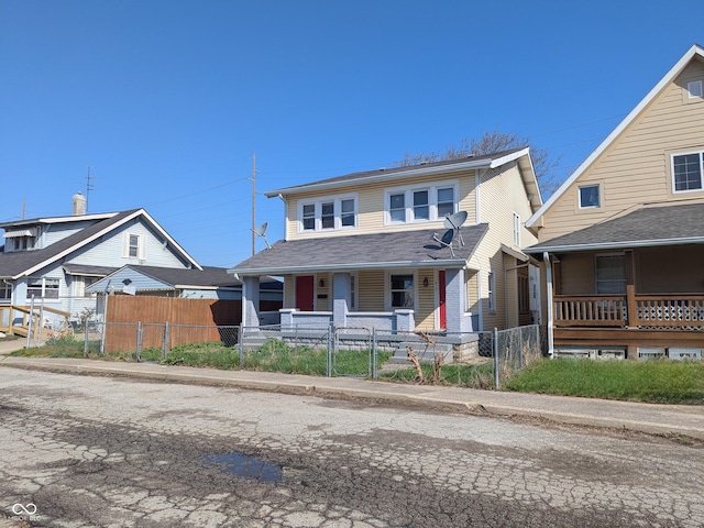 408 E Beecher St, Indianapolis, IN 46225 - view of front of house with a porch, a fenced front yard, and a gate