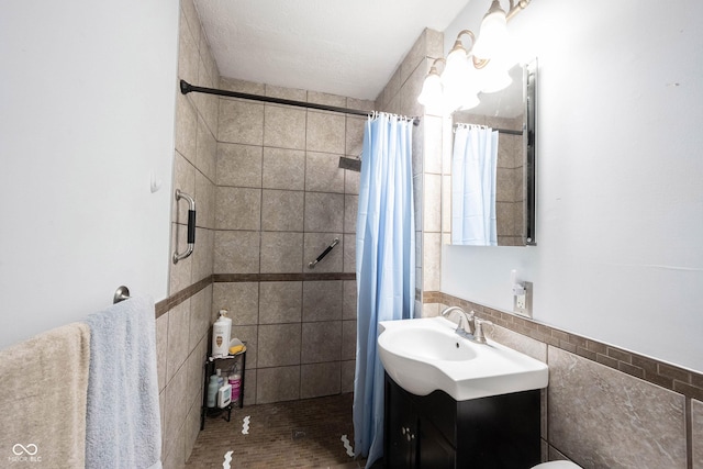30 Sleepy Hollow Ct, Westfield, IN 46074 - bathroom with vanity, tiled shower, and tile walls