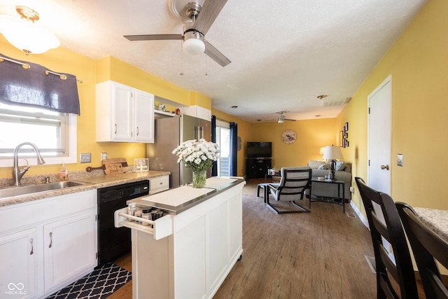 30 Sleepy Hollow Ct, Westfield, IN 46074 - kitchen with ceiling fan, dark wood finished floors, a sink, black dishwasher, and white cabinetry