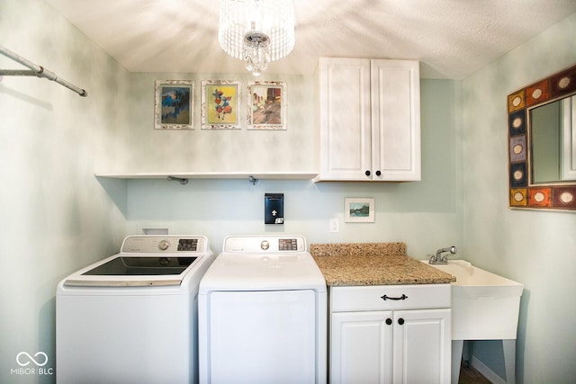 1060 Cape Coral Dr, Cicero, IN 46034 - laundry area featuring a chandelier, independent washer and dryer, a sink, and cabinet space