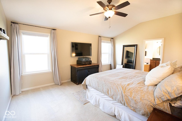 1060 Cape Coral Dr, Cicero, IN 46034 - bedroom with baseboards, vaulted ceiling, light carpet, connected bathroom, and ceiling fan