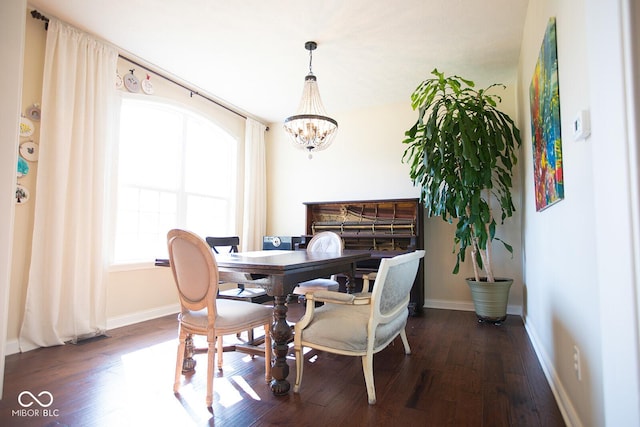 1060 Cape Coral Dr, Cicero, IN 46034 - dining area with an inviting chandelier, baseboards, and dark wood-style floors