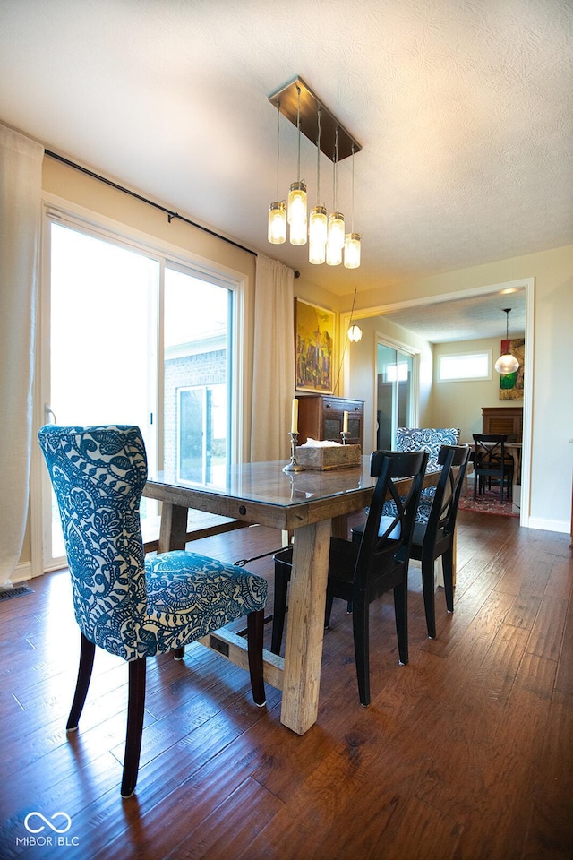 1060 Cape Coral Dr, Cicero, IN 46034 - dining room with visible vents, baseboards, and hardwood / wood-style floors