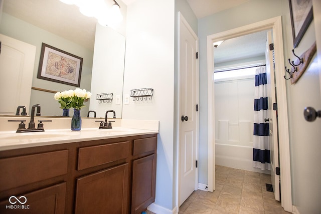1060 Cape Coral Dr, Cicero, IN 46034 - full bath with double vanity, baseboards, a sink, and shower / tub combo