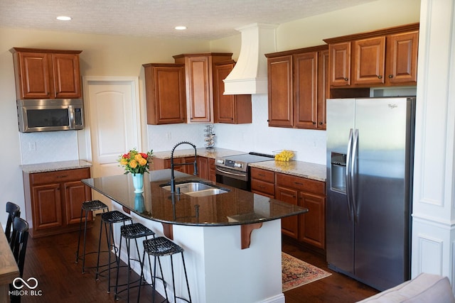 1060 Cape Coral Dr, Cicero, IN 46034 - kitchen with custom exhaust hood, brown cabinets, a sink, and stainless steel appliances
