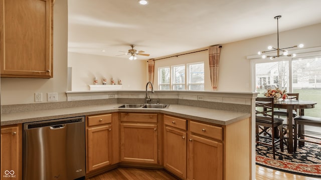 12561 Gladecrest Dr, Carmel, IN 46033 - kitchen featuring dishwasher, a sink, a peninsula, light wood-style flooring, and a ceiling fan