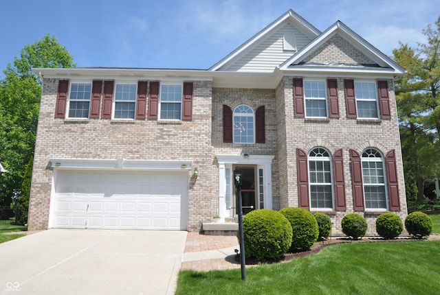 12561 Gladecrest Dr, Carmel, IN 46033 - view of front facade featuring concrete driveway, brick siding, and a garage