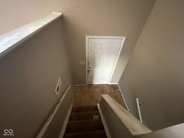 stairway featuring baseboards