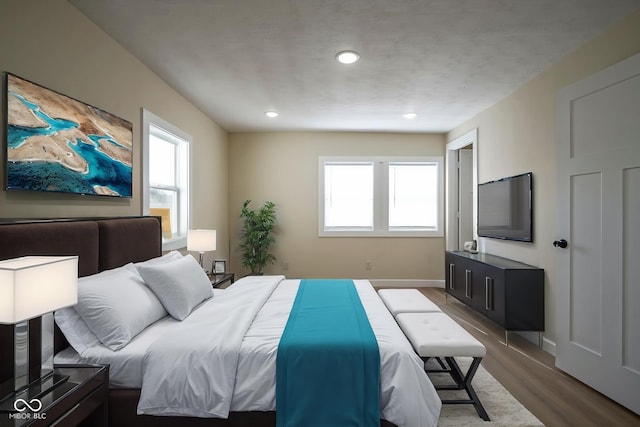 bedroom featuring recessed lighting, baseboards, and dark wood finished floors