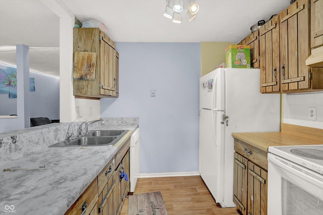 kitchen with white electric range, brown cabinetry, light wood-type flooring, light countertops, and a sink