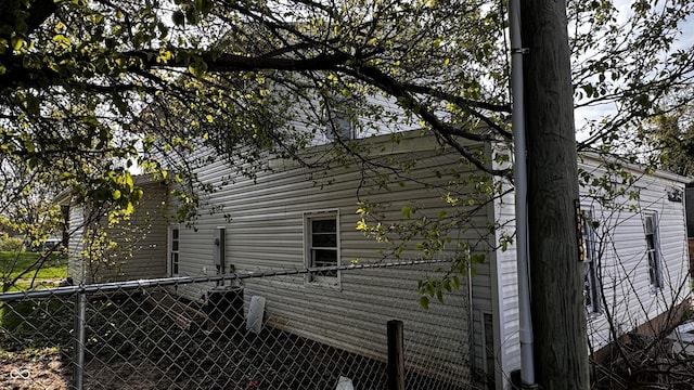 view of property exterior with fence