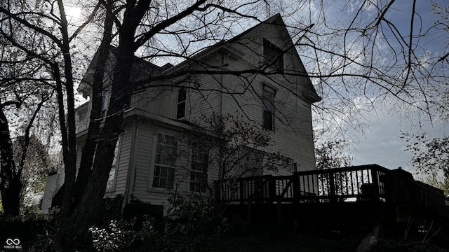 view of property exterior with a deck