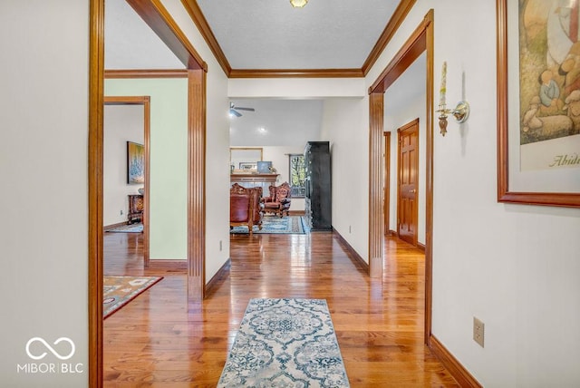 7113 Lakeside Woods Dr, Indianapolis, IN 46278 - corridor with ornamental molding, wood finished floors, baseboards, and a textured ceiling