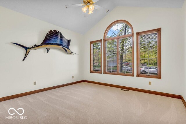 7113 Lakeside Woods Dr, Indianapolis, IN 46278 - empty room with light colored carpet, baseboards, a ceiling fan, and vaulted ceiling