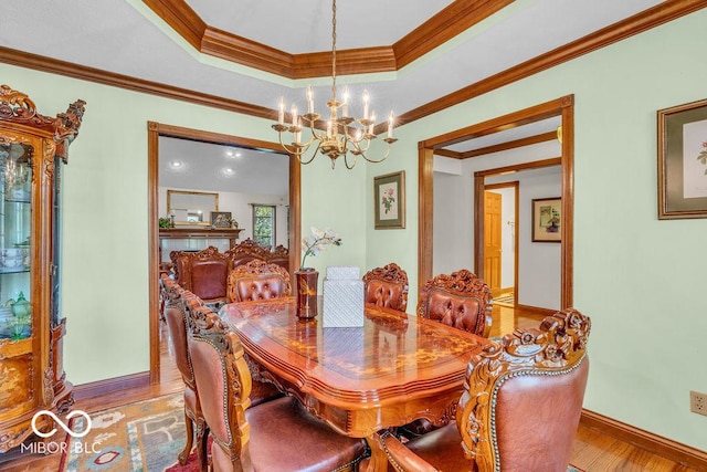 7113 Lakeside Woods Dr, Indianapolis, IN 46278 - dining area with a chandelier, baseboards, wood finished floors, and crown molding
