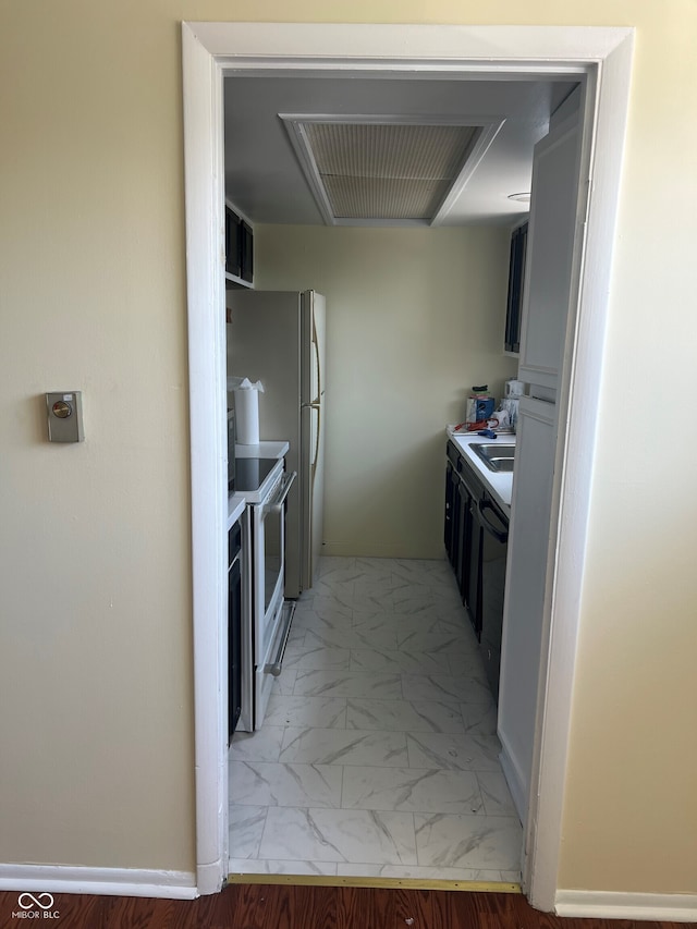 kitchen featuring marble finish floor, dishwasher, and white range with electric stovetop