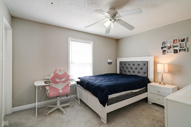 10597 Cyrus Dr, Indianapolis, IN 46231 - bedroom with light carpet, a ceiling fan, a textured ceiling, and baseboards