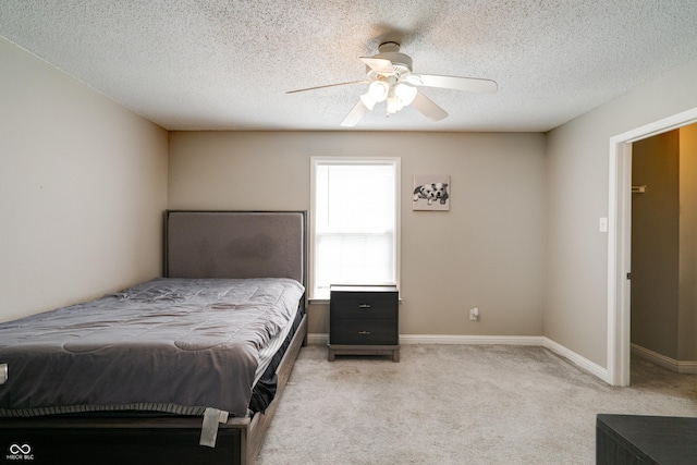 10597 Cyrus Dr, Indianapolis, IN 46231 - bedroom featuring light colored carpet, a ceiling fan, baseboards, and a textured ceiling