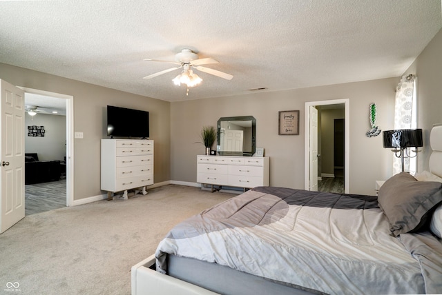 10597 Cyrus Dr, Indianapolis, IN 46231 - carpeted bedroom with a textured ceiling, a ceiling fan, and baseboards