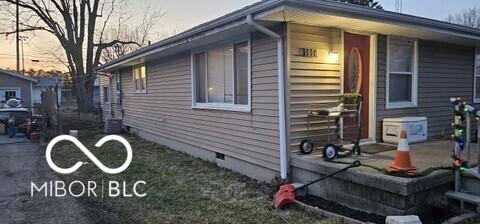 view of side of home featuring crawl space