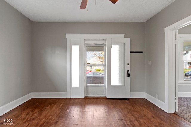 67 S 9th Ave, Beech Grove, IN 46107 - foyer entrance featuring hardwood / wood-style floors, plenty of natural light, a ceiling fan, and baseboards