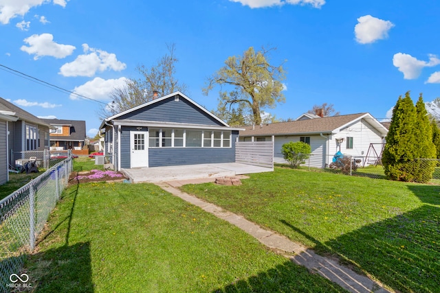 67 S 9th Ave, Beech Grove, IN 46107 - back of property featuring a yard, a patio, and a fenced backyard