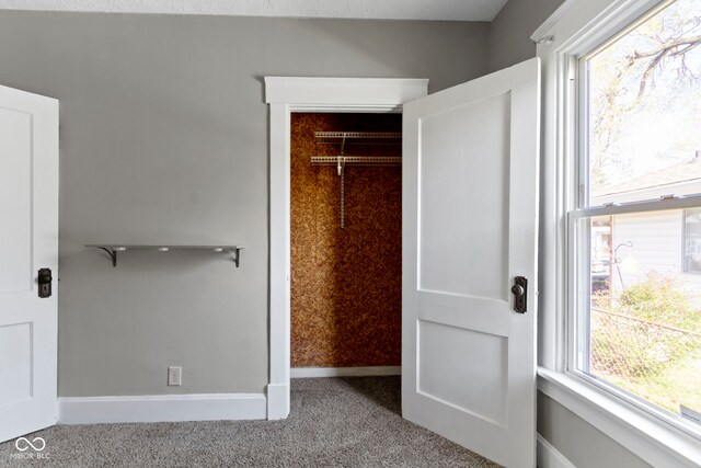 67 S 9th Ave, Beech Grove, IN 46107 - unfurnished bedroom featuring carpet flooring and baseboards