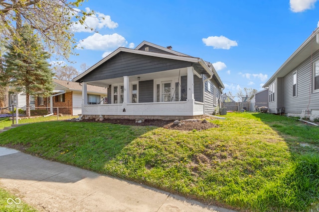 67 S 9th Ave, Beech Grove, IN 46107 - view of front of home with central AC unit, a front lawn, and fence