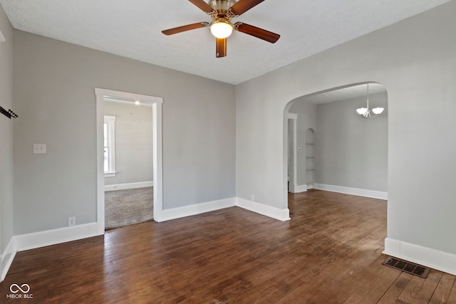 67 S 9th Ave, Beech Grove, IN 46107 - spare room featuring wood finished floors, visible vents, arched walkways, and a ceiling fan