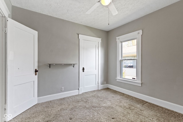 67 S 9th Ave, Beech Grove, IN 46107 - unfurnished bedroom featuring ceiling fan, carpet floors, a textured ceiling, and baseboards