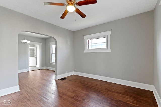 67 S 9th Ave, Beech Grove, IN 46107 - empty room featuring a wealth of natural light, hardwood / wood-style flooring, baseboards, and arched walkways