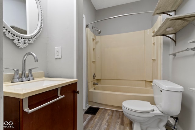 67 S 9th Ave, Beech Grove, IN 46107 - full bath featuring toilet, vanity, wood finished floors, and  shower combination