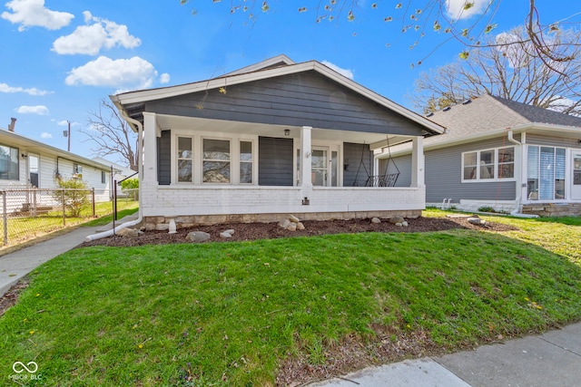 67 S 9th Ave, Beech Grove, IN 46107 - view of front of home with a porch, a front lawn, and fence