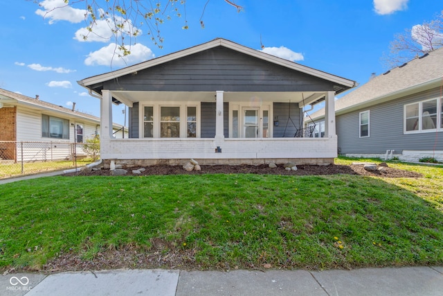 67 S 9th Ave, Beech Grove, IN 46107 - view of front of house featuring a porch, fence, and a front yard
