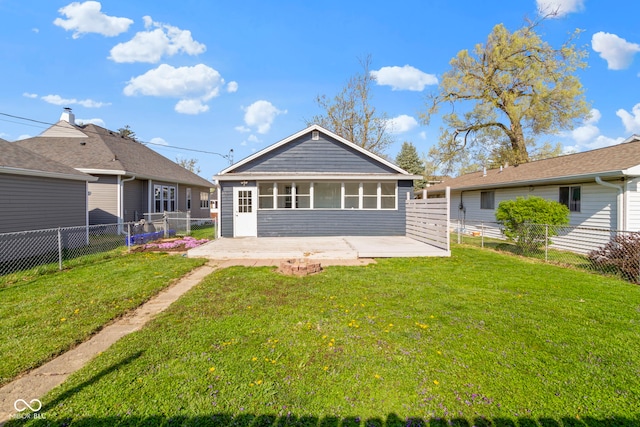 67 S 9th Ave, Beech Grove, IN 46107 - rear view of house with a yard, a patio area, a sunroom, and a fenced backyard