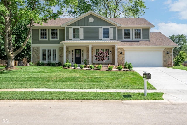 3316 Eden Way Cir, Carmel, IN 46033 - view of front of property with stone siding, driveway, board and batten siding, and a garage