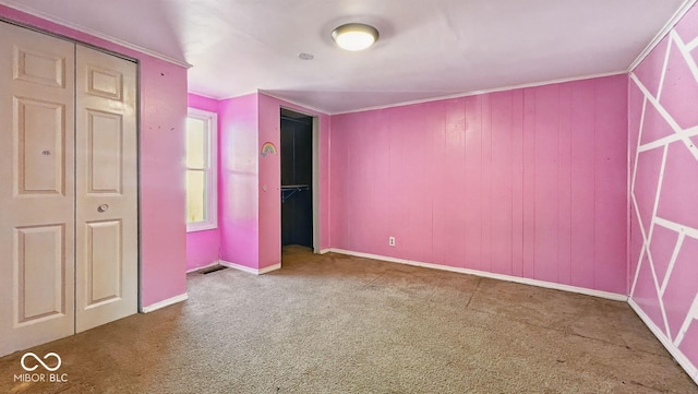 3346 S Lockburn St, Indianapolis, IN 46221 - unfurnished bedroom featuring a closet, carpet flooring, and baseboards