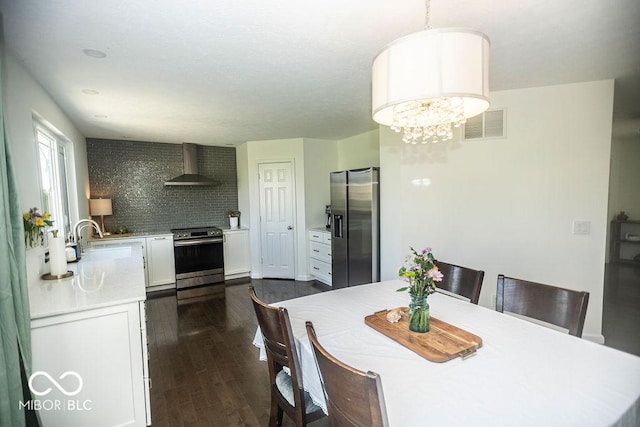 3896 Woods Bay Ln, Plainfield, IN 46168 - dining room with dark wood-type flooring, a notable chandelier, and visible vents