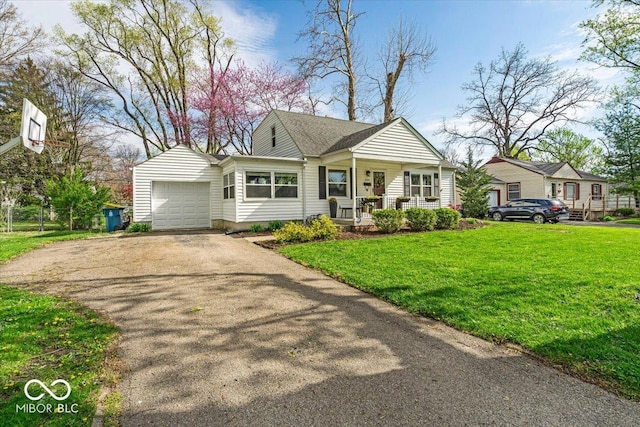 2204 Pamela Dr, Indianapolis, IN 46220 - view of front of property featuring a front lawn, driveway, a porch, roof with shingles, and a garage