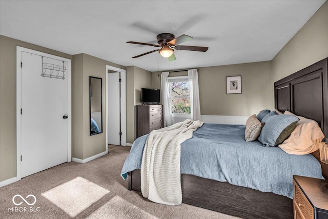 2204 Pamela Dr, Indianapolis, IN 46220 - bedroom featuring baseboards, a ceiling fan, and carpet