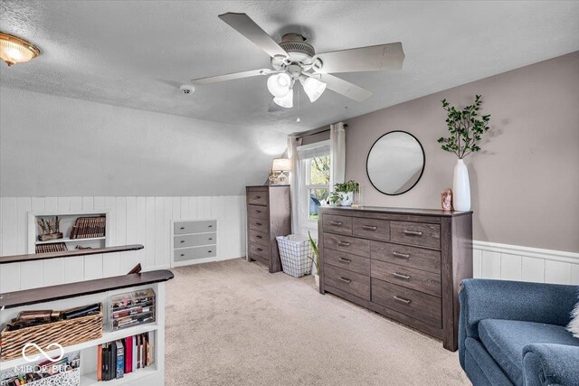 2204 Pamela Dr, Indianapolis, IN 46220 - bedroom featuring light colored carpet, vaulted ceiling, wood walls, and a textured ceiling