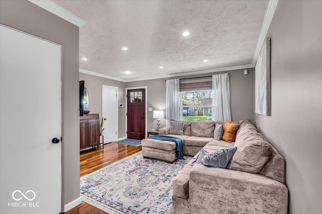 2204 Pamela Dr, Indianapolis, IN 46220 - living room with recessed lighting, wood finished floors, a textured ceiling, and crown molding