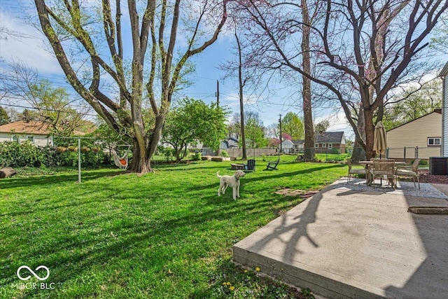 2204 Pamela Dr, Indianapolis, IN 46220 - view of home's community with fence, outdoor dining area, a yard, and a patio